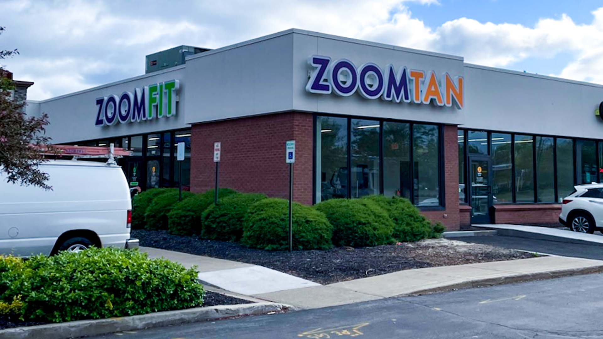 Zoom Fit & Zoom Tan storefront in penfield, ny